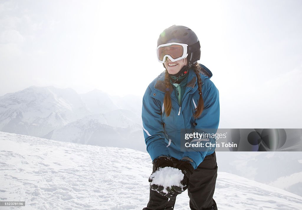 Young woman with a snowball