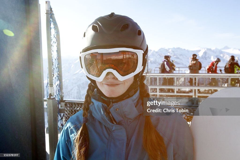 Young woman in snowboard gear