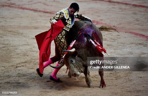 Spanish bullfighter Alejandro Talavante performs a pass to a bull with a muleta during a bullfight of the San Fermin festival in Pamplona, northern...