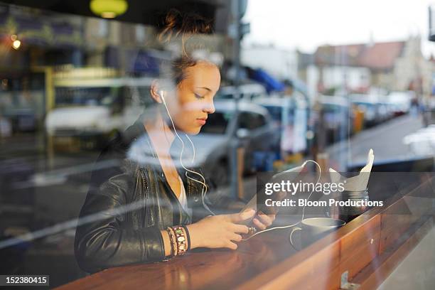 girl using technology - cafe window stock pictures, royalty-free photos & images