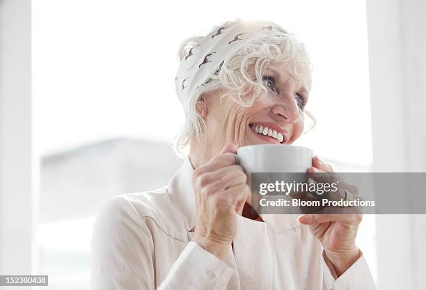 mature lady smiling - hair band stock pictures, royalty-free photos & images