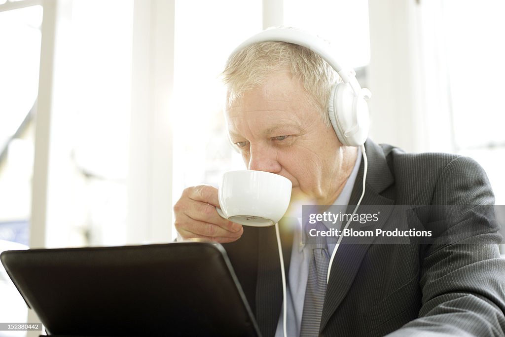 Business man wearing headphones