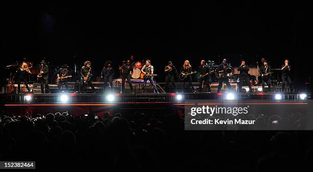 Bruce Springsteen and The E Street Band perform during the "Wrecking Ball" tour at MetLife Stadium on September 19, 2012 in East Rutherford, New...