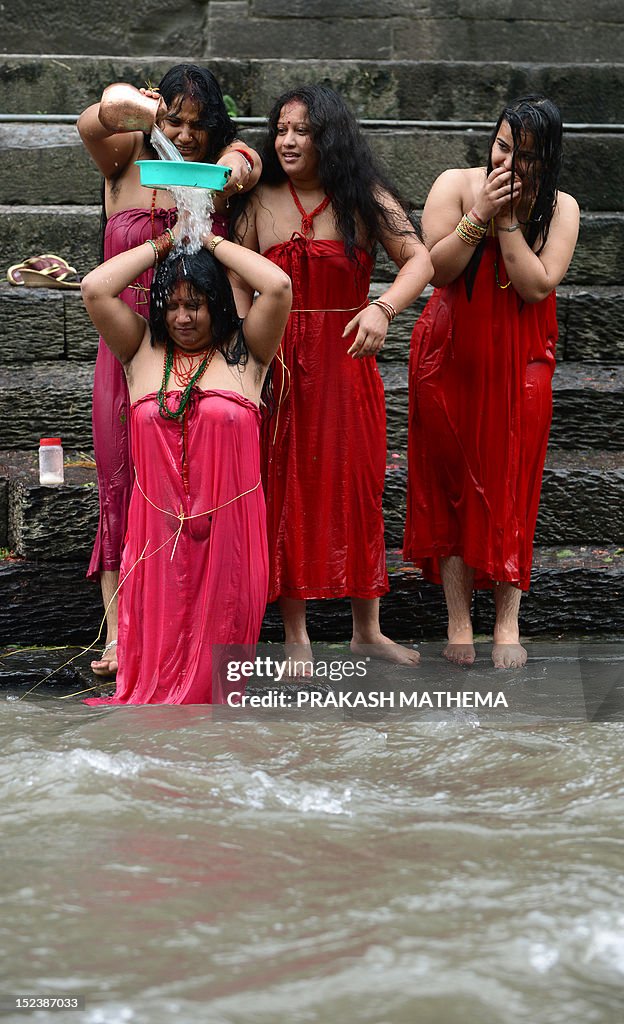 Nepalese Hindu Women Take A Ritual Bath In The Bagmati River During