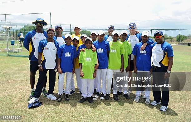 Champaka Ramanayake, Akila Dhananjaya, Ruwan Kalpage, Charith Senanayake, Graham Ford and Rangana Herath of Sri Lanka pose for a picture with...