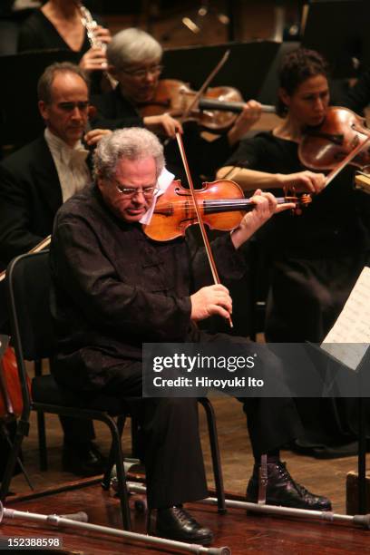 The violinist Itzhak Perlman performing with the New York Philharmonic, conducted by Daniel Boico, in "A Concert to End Polio" at Avery Fisher Hall...