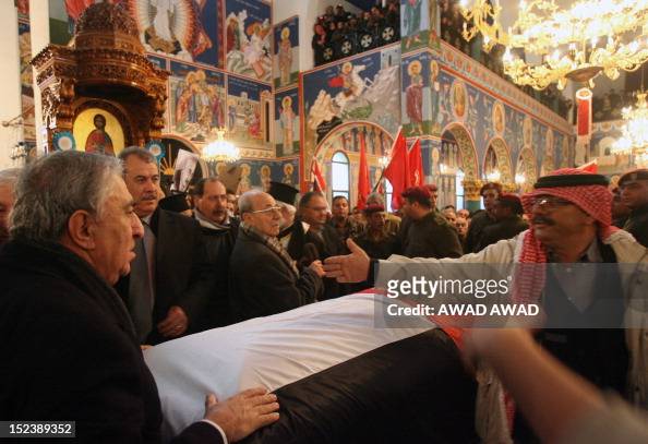 Mourners, including the head of the Damascus-based Democratic Front ...