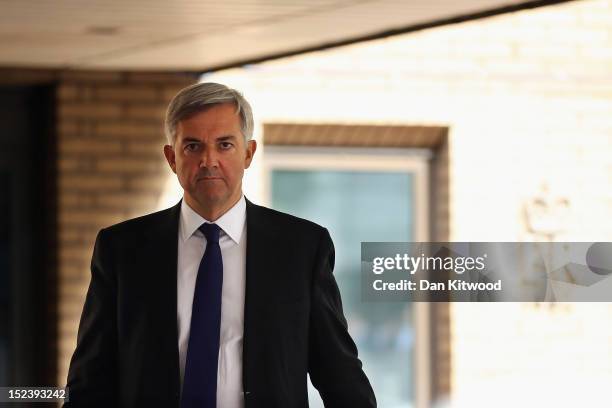 Former Cabinet Minister Chris Huhne leaves Southwark Crown Court after a pre-trial hearing on September 20, 2012 in London, England. Mr Huhne and his...