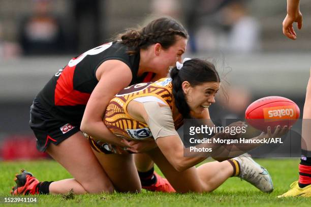 Scarlett Orritt of the Bombers tackles Annie Muir of the Hawks during the VFLW Elimination Final match between Box Hill and Essendon at Box Hill City...
