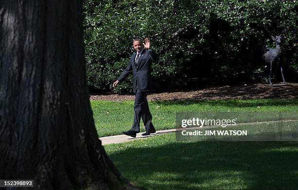 President Barack Obama waves as he departs the White House in Washington, DC, September 20, 2012 enroute to campaign events in Florida. AFP PHOTO/Jim...