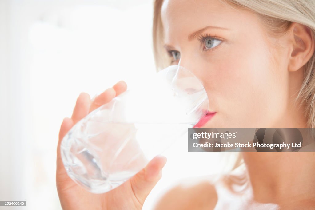 Caucasian woman drinking water