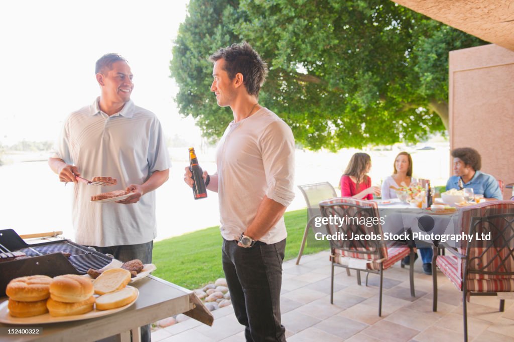 Friends barbecuing together