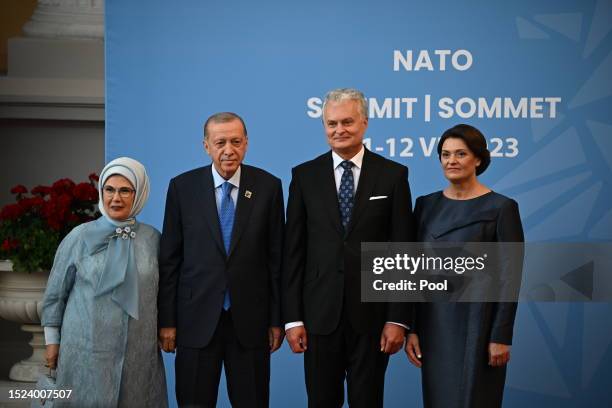 Turkey's President Recep Tayyip Erdogan and his wife Emine Erdogan, Lithuania's President Gitanas Nauseda and his wife Diana Nausediene pose upon...