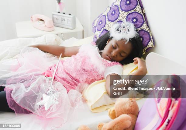 black girl sleeping in fairy costume - princess bedroom stock pictures, royalty-free photos & images