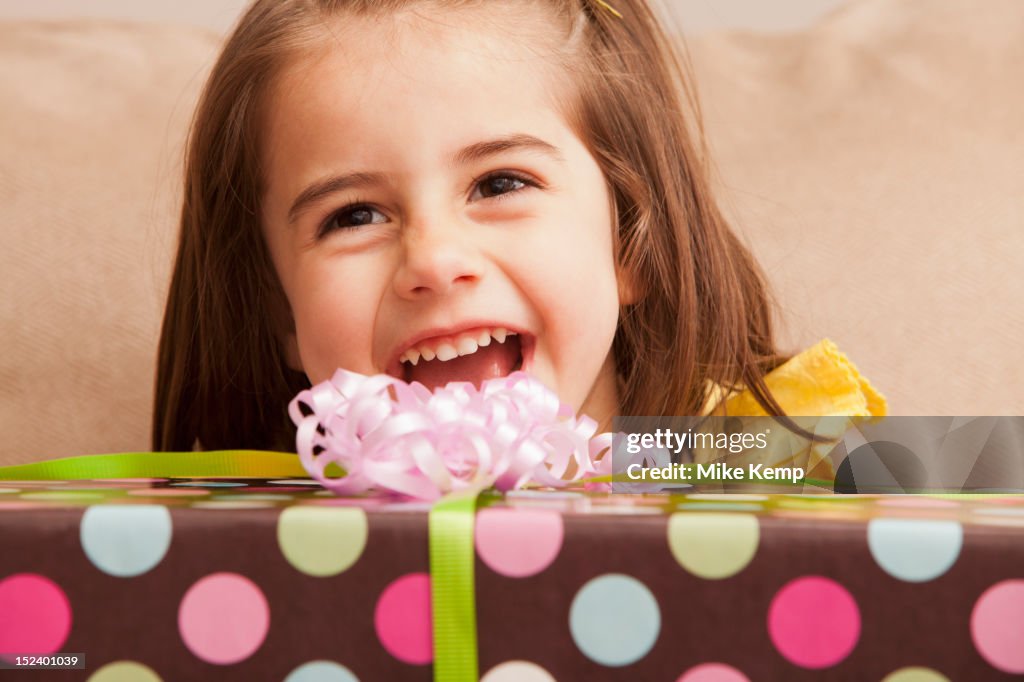 Caucasian girl holding gift