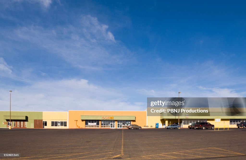 Empty parking lot in strip mall