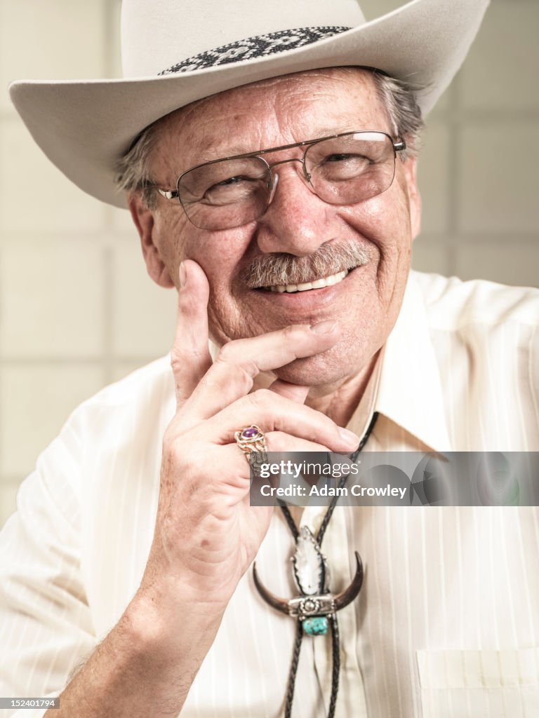 Smiling Caucasian man in cowboy hat