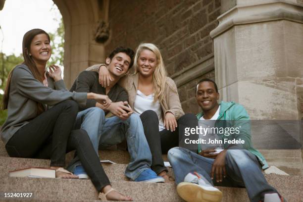 students sitting together on campus steps - saint louis university bildbanksfoton och bilder