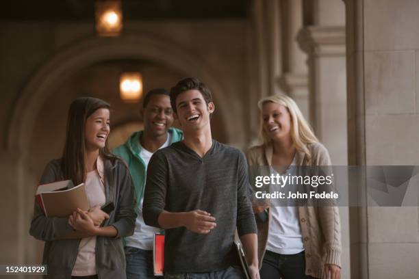 students walking together on campus - education building stock pictures, royalty-free photos & images