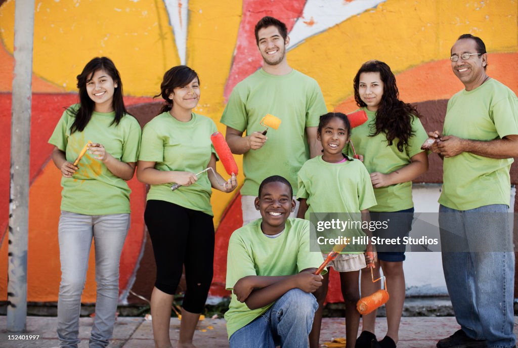 Volunteers painting wall