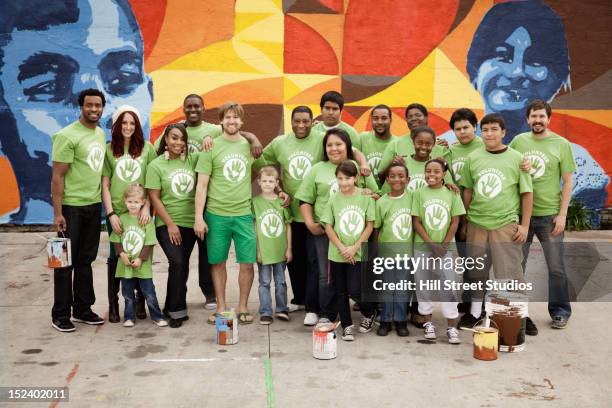 volunteers standing together - mural portrait stock pictures, royalty-free photos & images