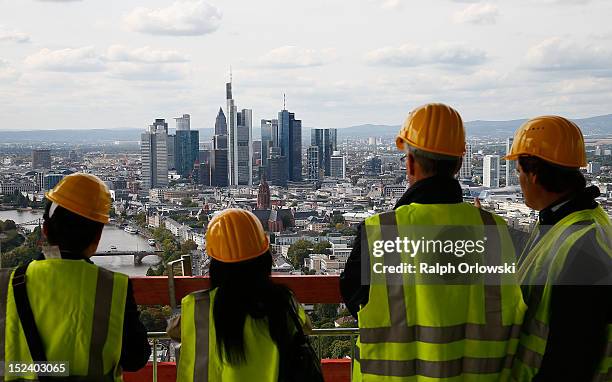 Visitors look from the top floor of the new European Central Bank headquarters as construction continues, during a media tour on September 20, 2012...