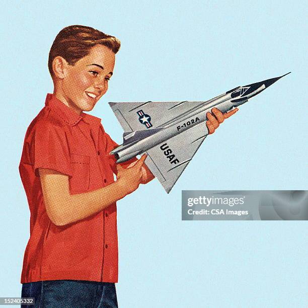 illustrations, cliparts, dessins animés et icônes de garçon tenant un jouet avion - avion de chasse
