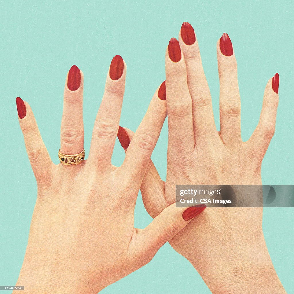 Women's Hands With Red Polish