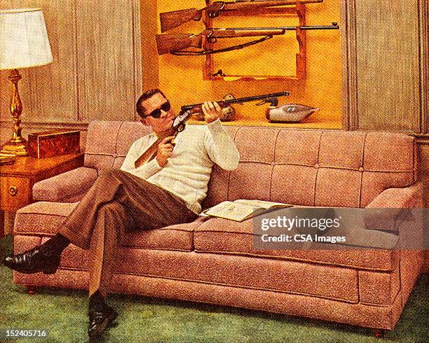 man wearing sunglasses and holding gun - man cave stock illustrations