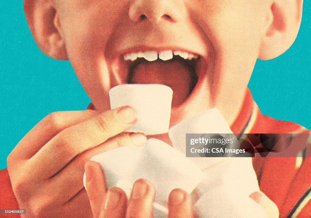 Boy Eating Marshmellows