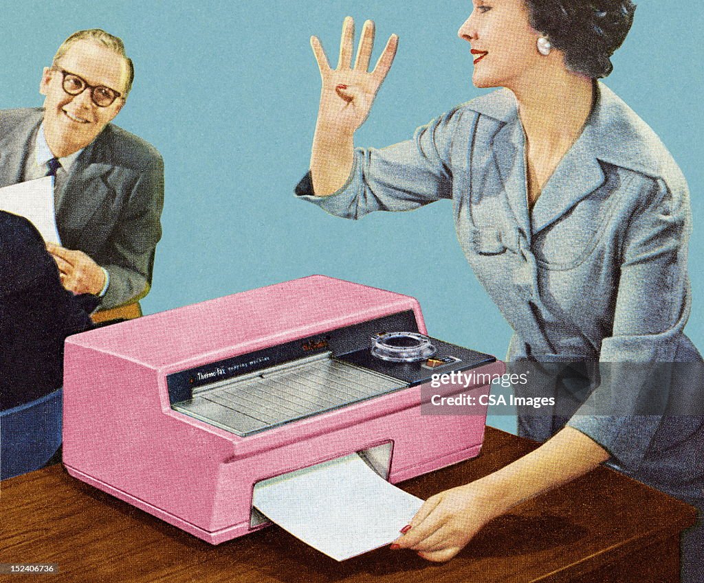 Woman Using Vintage Fax Machine