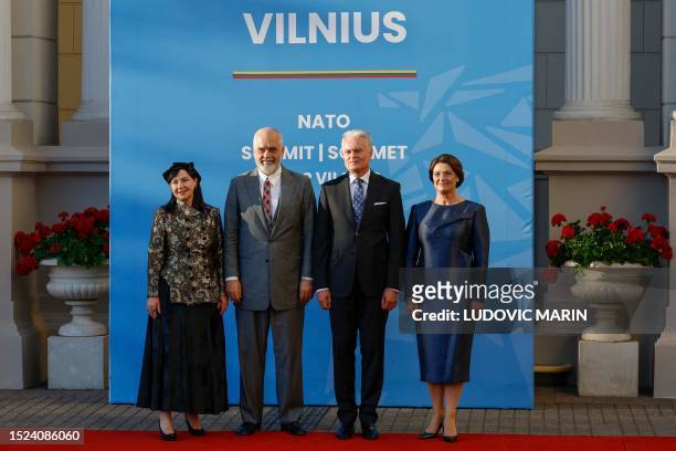 Albania's Prime Minister Edi Rama , his wife Linda Rama , Lithuania's President Gitanas Nauseda , flanked by his wife Diana Nausediene , pose ahead...