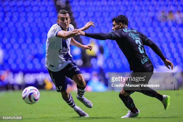 Daniel Álvarez of Puebla battles for the ball against Omar Campos of Santos during the 2nd round match between Puebla and Santos Laguna as part of...