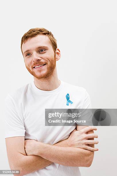 man wearing prostate cancer awareness ribbon - prostate cancer stockfoto's en -beelden