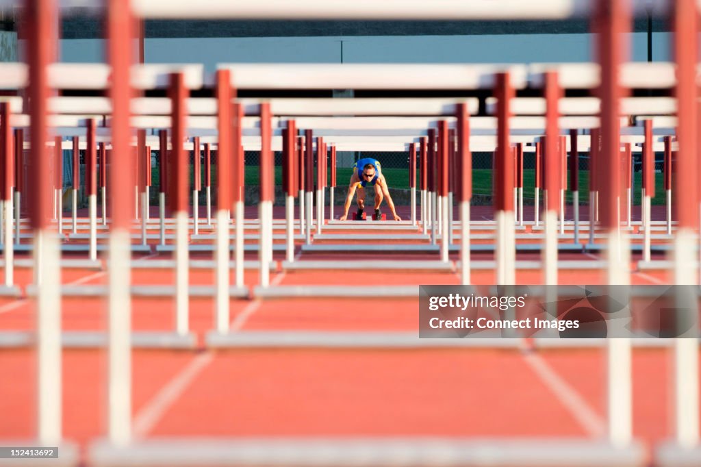 Male hurdler at starting line