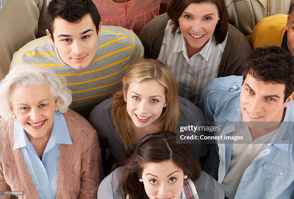 Group of people looking at camera, high angle