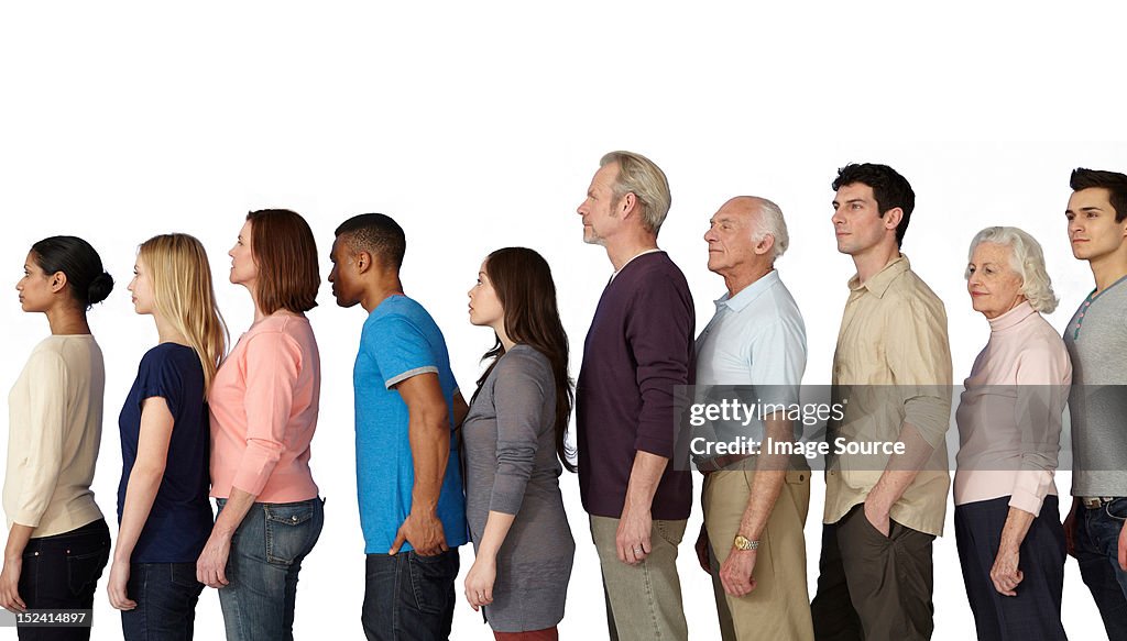 Group of people in a line, side view