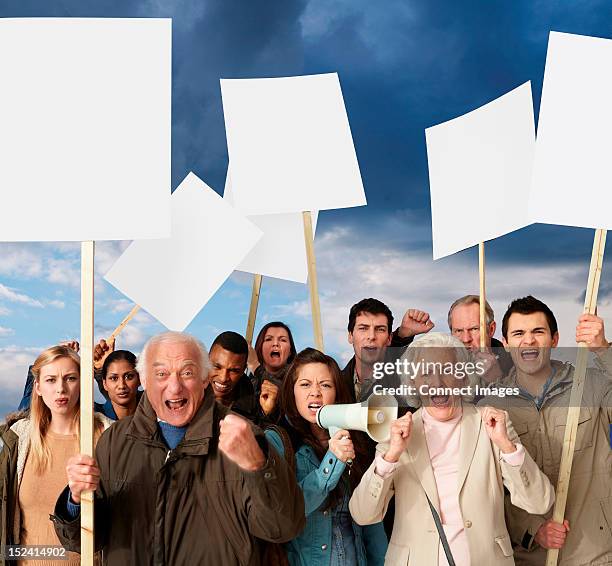 group of angry protesters holding blank banners - angry protestor stock pictures, royalty-free photos & images