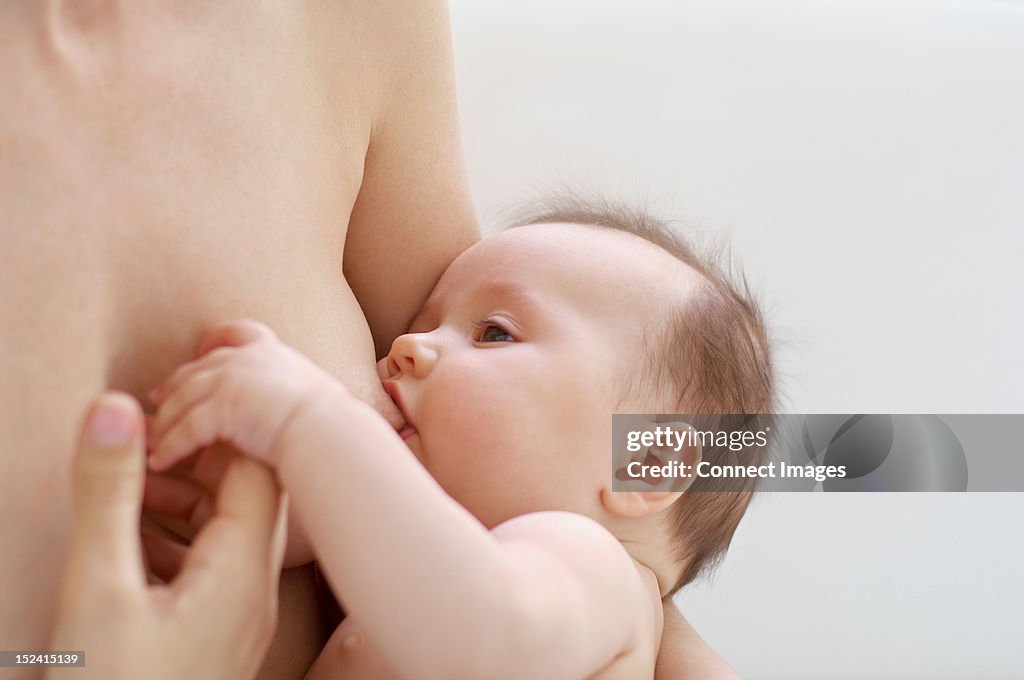 Mother breastfeeding baby