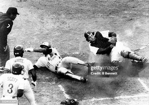 Warren Cromartie of the Montreal Expos is called out by umpire Eric Gregg as catcher Mike Scioscia of the Los Angeles Dodgers makes the tag during...