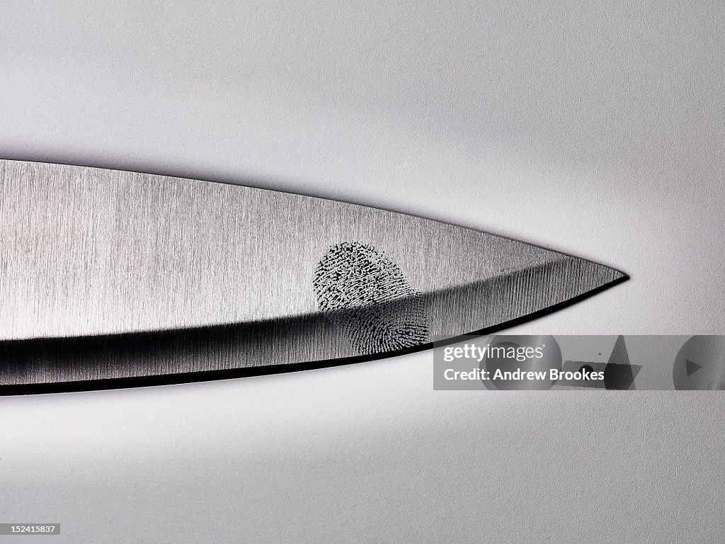 Close up of fingerprint on knife blade