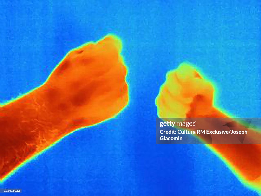 Thermal image of hands playing game
