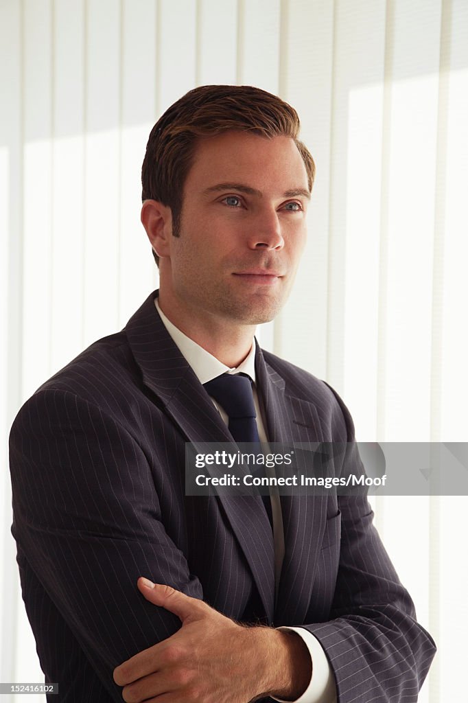 Businessman standing with arms crossed