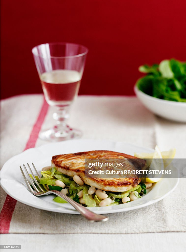 Plate of chicken with bean salad