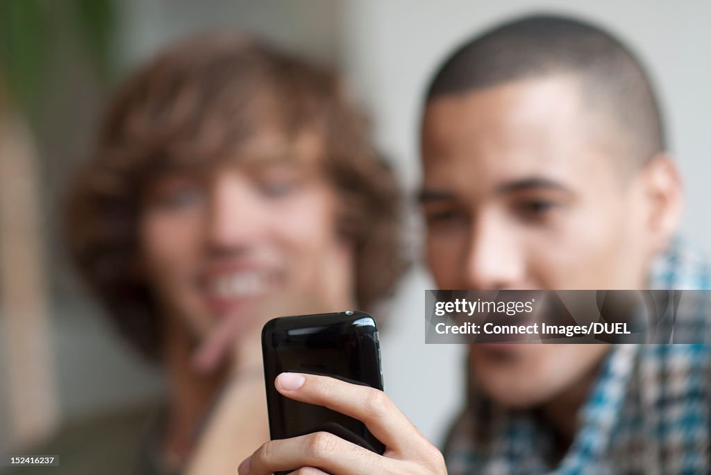 Close up of man using cell phone