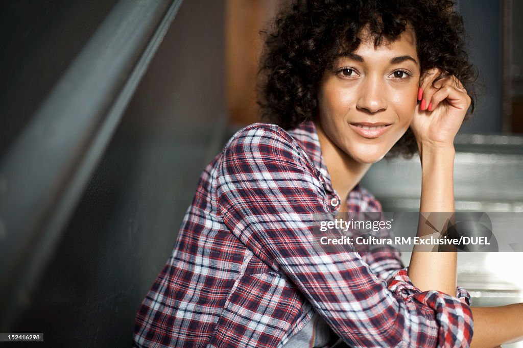 Smiling woman sitting on steps