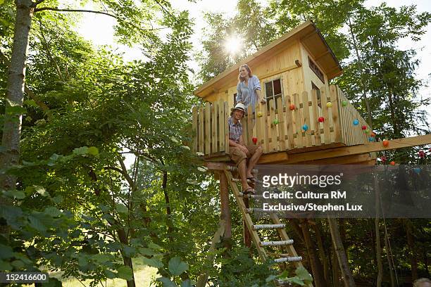 family playing in tree house - tree house stock pictures, royalty-free photos & images