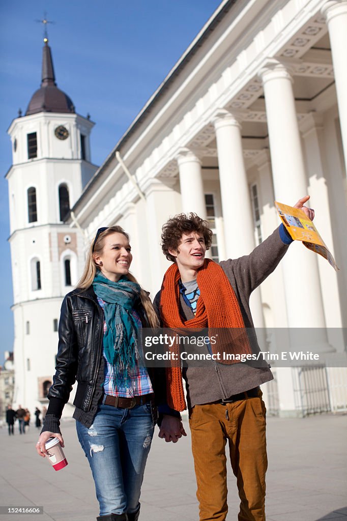 Couple walking together on city street