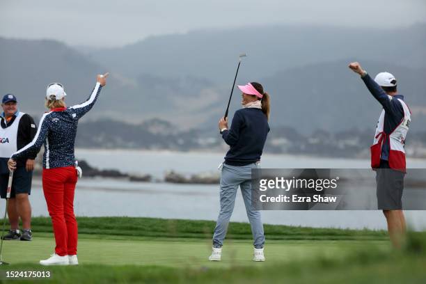 Michelle Wie West of the United States celebrates after making a long putt for par on the 18th green as Annika Sorenstam of Sweden and caddie Mike...