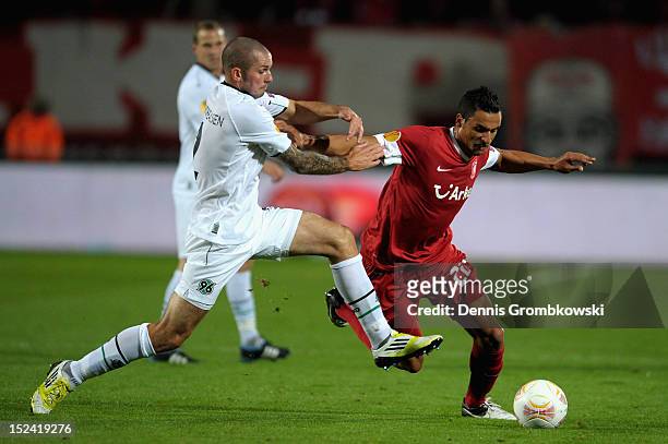 Leon Andreasen of Hannover challenges Nacer Chadli of Twente during the UEFA Europa League Group L match between Twente Enschede and Hannover 96 at...